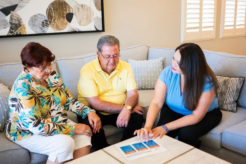 Viola walking clients through their plan options at home